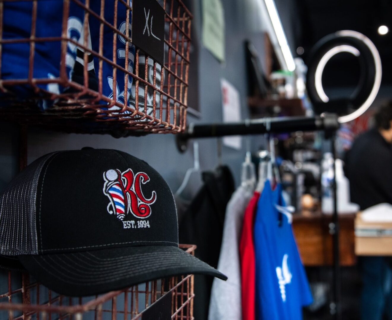 Black embroidered KC cap on shelf